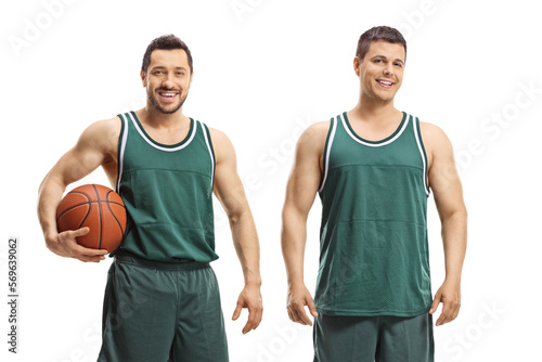 Basketball players posing with a ball