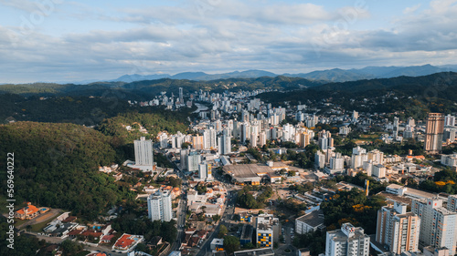 Fototapeta Naklejka Na Ścianę i Meble -  aerial image of downtown Blumenau, with Itajaí Açú River, Santa Catarina, southern Brazil, buildings, main streets, vegetation and sunny day