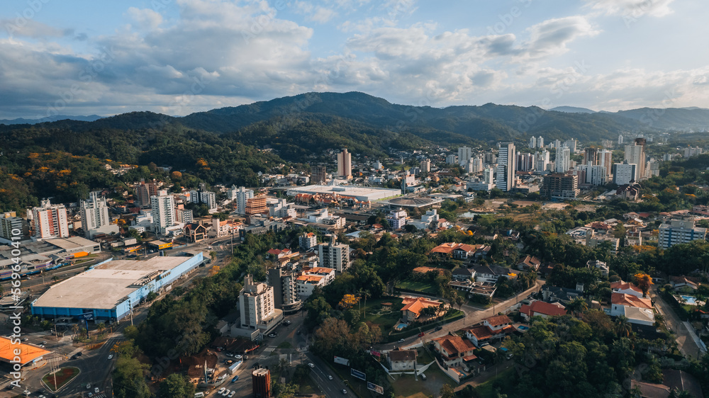 aerial image of downtown Blumenau, with Itajaí Açú River, Santa Catarina, southern Brazil, buildings, main streets, vegetation and sunny day