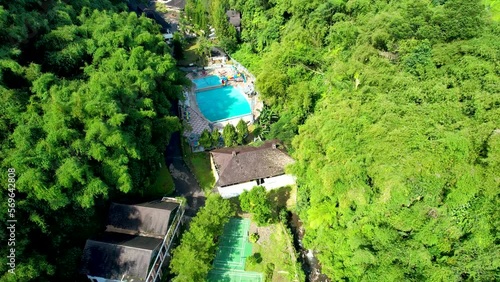 Aerial view of The Plot of land with house and swimming Pool Aerial Shot Top View. Lake Side Villa Puncak. 