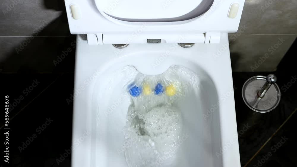 Top view flush water in the toilet. Modern toilet bowl in the interior