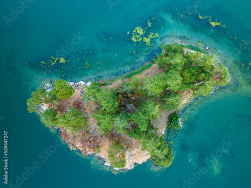 Overhead Aerial View of Small Isolated Island With Evergreen Trees in San Juans Washington State USA © CascadeCreatives