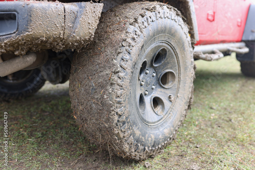 Closeup of dirty wheel of off road vehicle. © megaflopp