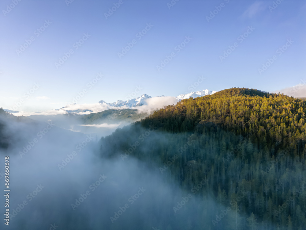 Canadian Mountain Landscape Nature Background. Aerial View. Sunny Winter Sunrise. Near Squamish, BC, Canada.