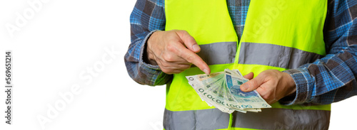 Картината върху платно Working man holds Polish zlotys in his hands