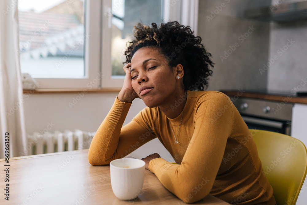 Woman is lost in thoughts at home Woman is lost in thoughts at home