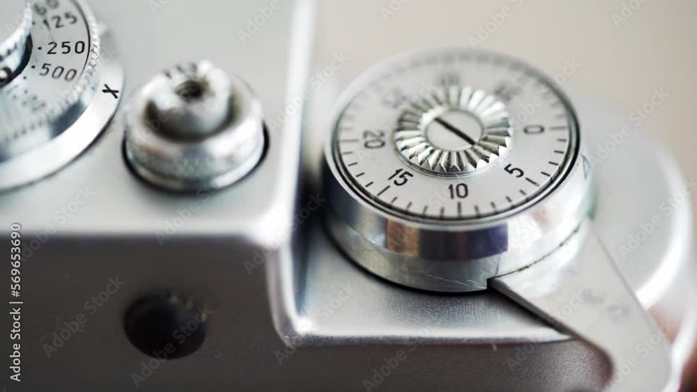 The lever for advancing the film of the camera to the cocking of the