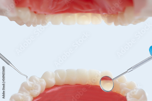 View from patient mouth with professional dental tools. Teeth care and protection concept. Closeup.