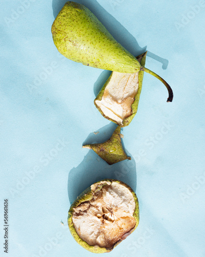 A smashed pear on a blue background