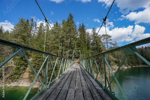 Bridge over wonderful lake Erlaufstausee in amazing mountain and forest scenery in austria. oetscherland near mariazell.  photo