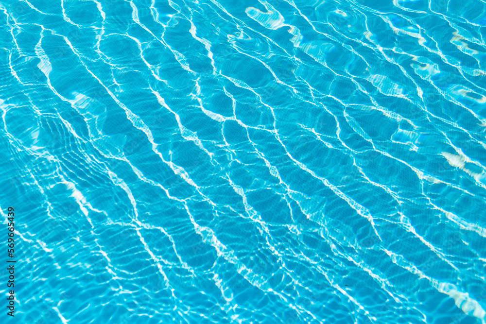 Amazing blue water texture in a pool with waves and ripples