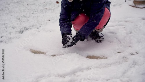 Wallpaper Mural The girl makes snow with her hands to play snowballs. Torontodigital.ca