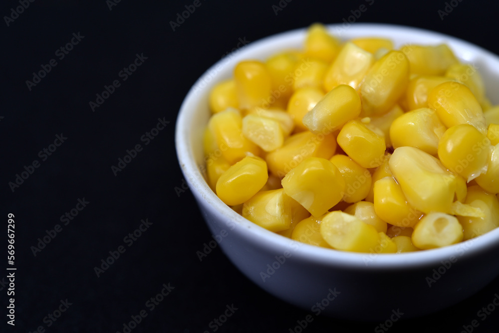 Fresh canned corn. Corn kernels in a white salad bowl. Corn in a cup. Fresh canned corn. Corn kernels in a white salad bowl. Corn in a cup.