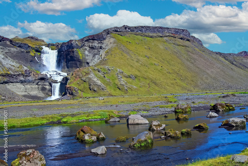 Beautiful icelandic landscape, river and small waterfall, blue summer sky - Eldgja volcanic canyon, Iceland photo