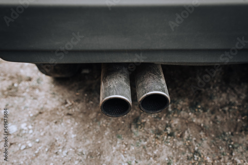 Two carbon fiber exhaust pipes of a sports car close-up. Photography, tuning.