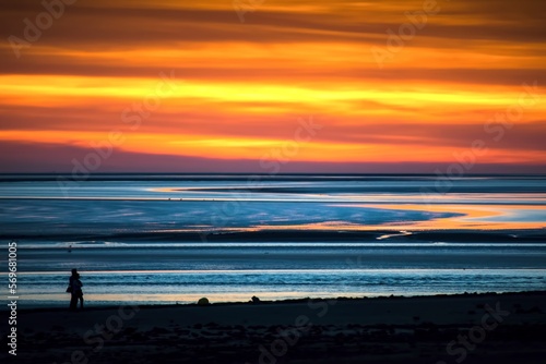 Silhouettes of couple hug enjoy sunset in beach together. Concepts of connections togetherness and freedom joy of life together. Memories and meaningful relationships © Evaldas