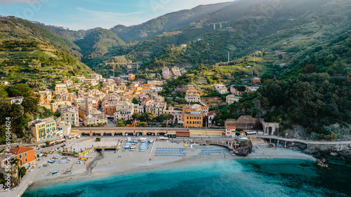 Aerial view of Monterosso and landscape of Cinque Terre,Italy.UNESCO Heritage Site.Picturesque colorful coastal village located on hills.Summer holiday,travel background.Italian Riviera with beaches