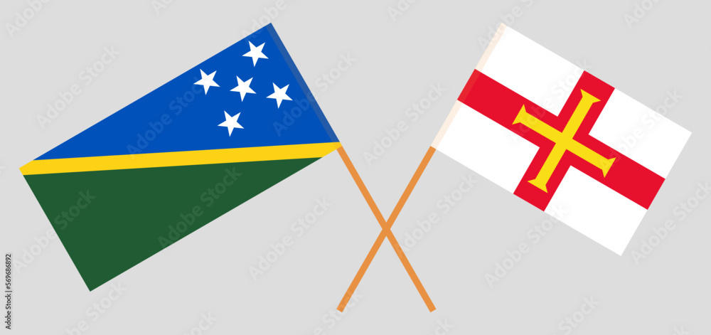 Crossed flags of Solomon Islands and Bailiwick of Guernsey. Official colors. Correct proportion