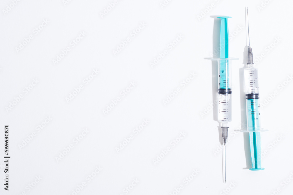 Disposable plastic syringe prepared for injection and vaccination in the hospital. The concept of medicine and health Disposable plastic syringe prepared for injection and vaccination in the hospital. The concept of medicine and health