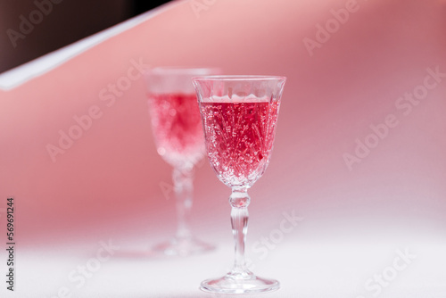 Two pink cocktails for Valentine's day celebration. Love and anniversary setting with hearts. Romantic concept