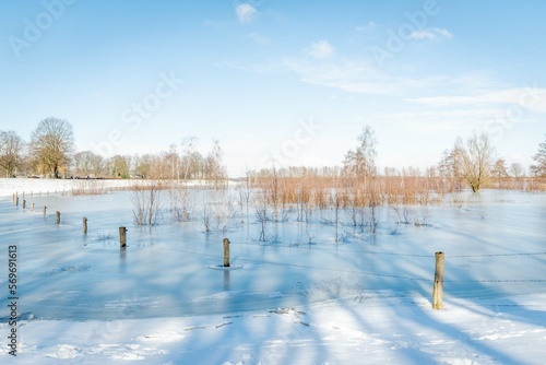 Frozen lake in wintertime photo