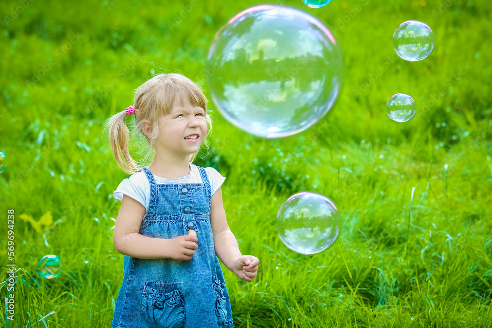 happy child playing a fun and draws on the nature of the park happy child playing a fun and draws on the nature of the park