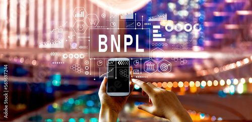 BNPL - Buy Now Pay Later theme with big city lights at night