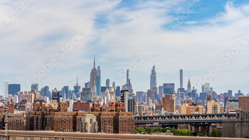 New York Midtown skyline seen from the Brooklyn Bridge with empire state building, chrysler building and one vanderbilt