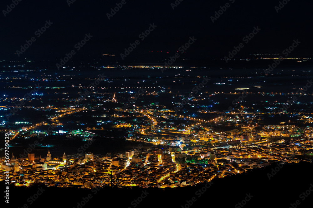 Naklejka premium Aerial city panorama at night, city lights at night, skyline, Comiso / Sicily.