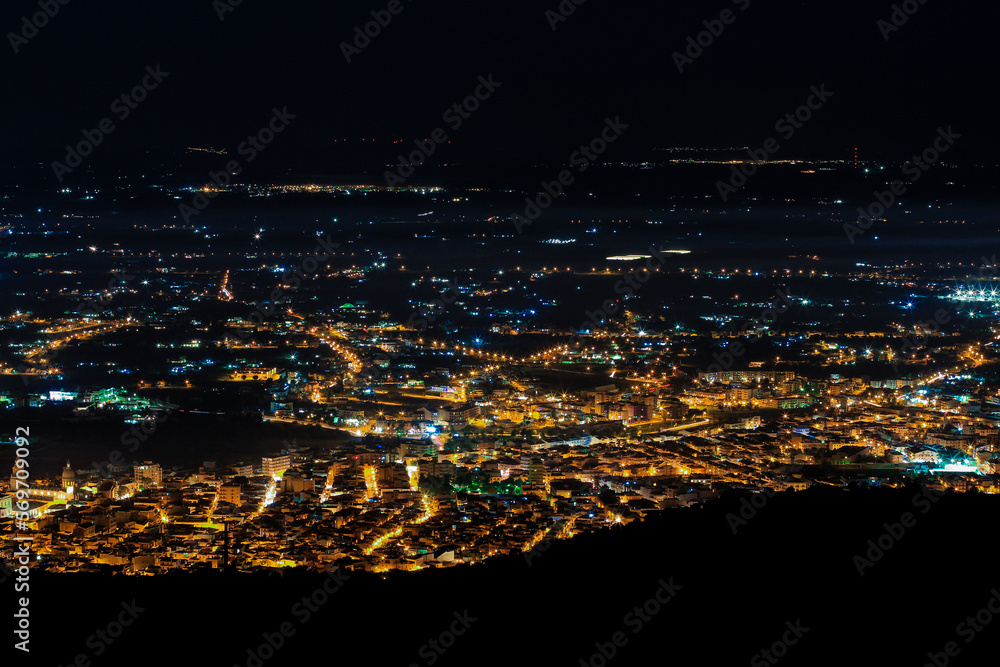 Fototapeta premium Aerial city panorama at night, city lights at night, skyline, Comiso / Sicily.