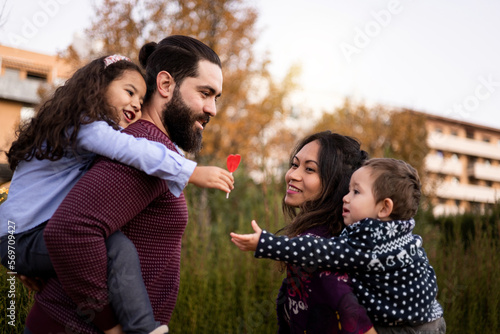 Photos The interracial family enjoys a day at the park