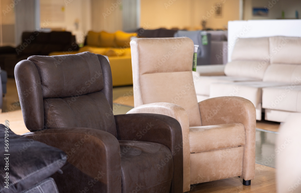 Obraz premium Two cozy armchairs in furniture showroom