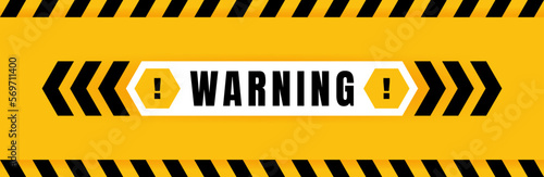 Warning badge placed on yellow background with black and yellow line striped. Attention label with Exclamation mark on hexagon. Vector illustration