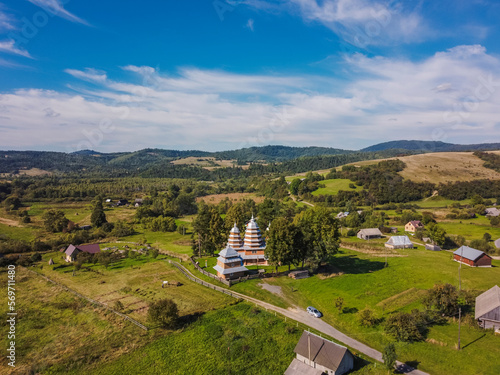Wallpaper Mural Aerial vIew of wood church by drone. Summer Ukraine Lviv region, West Ukraine. Torontodigital.ca