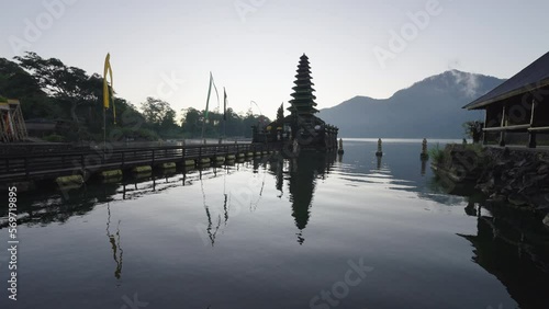 Lockdown Reflection Of Pura Jati Batur In Lake Against Clear Sky - Bali, Indonesia photo