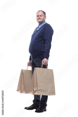 in full growth. casual mature man with shopping bags. © ASDF