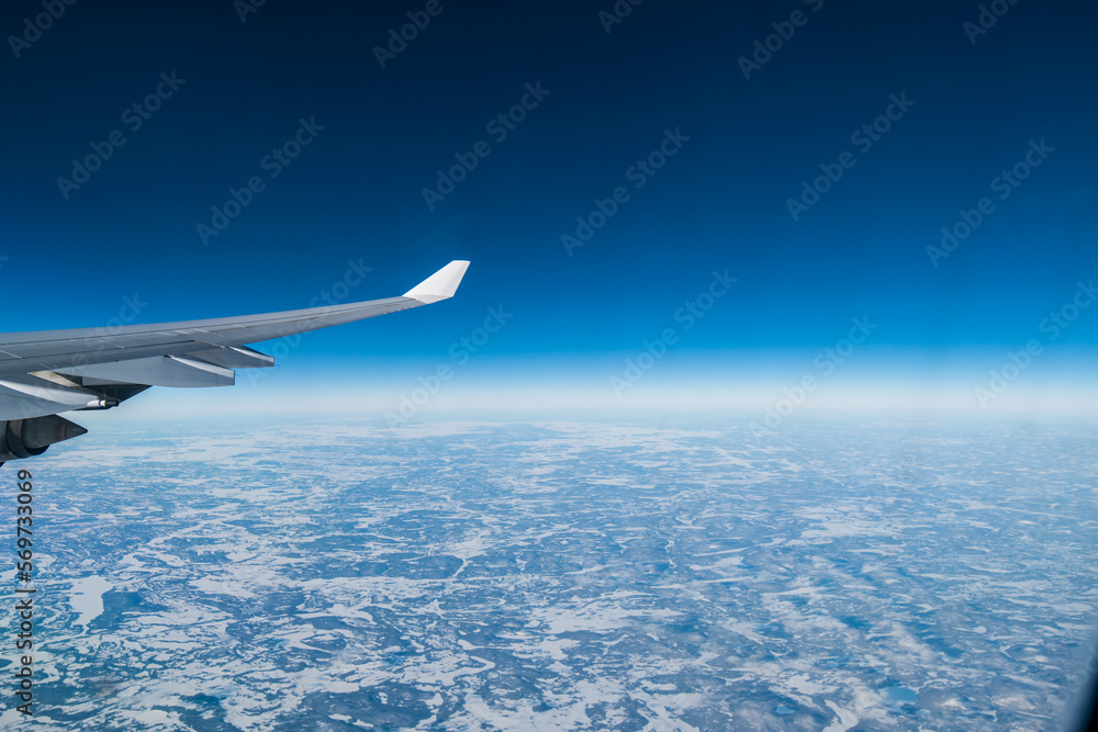 flying and traveling. Airplane interior or jet window with clouds and sky. Sky view from a high angle on the plane. flying and traveling. Airplane interior or jet window with clouds and sky. Sky view from a high angle on the plane.