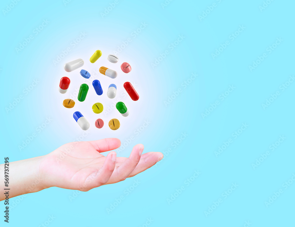 Diet. Nutrition. Healthy eating, lifestyle. Vitamin D, E, A in capsule. Prescription medical concept. Pharmacist. Variety of pills, doctor's hand with light blue background.