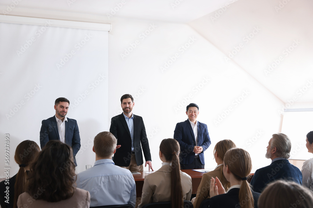 Fototapeta premium Business conference. People in meeting room listening to speaker report