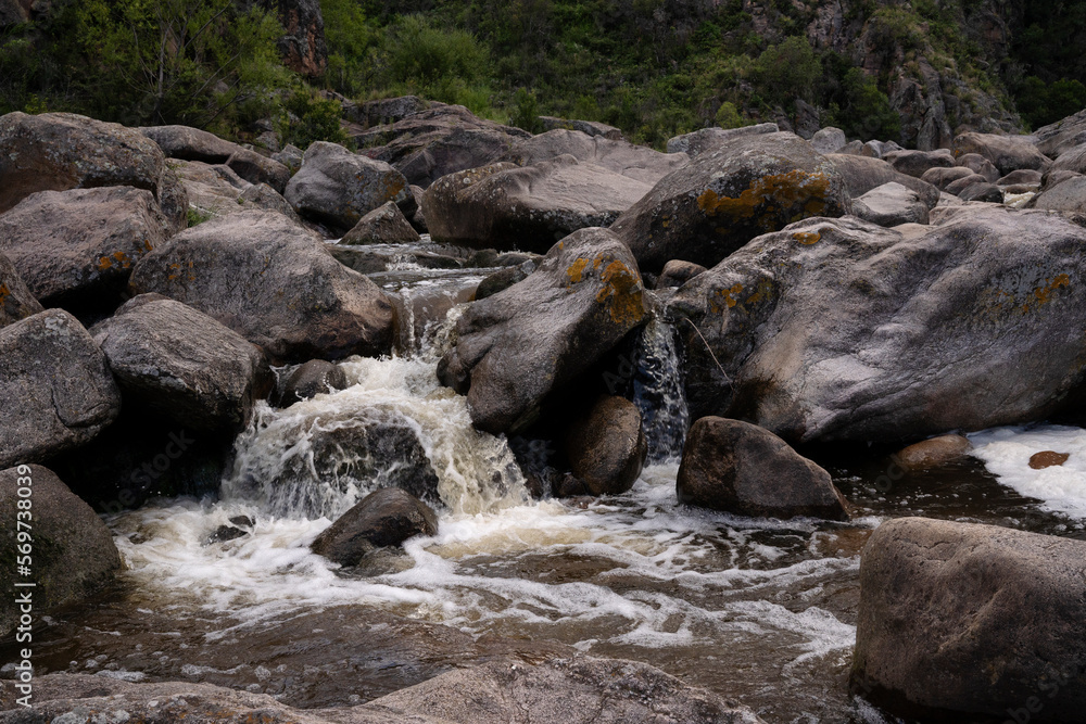 View of the river flowing across the rocks and forest. View of the river flowing across the rocks and forest.