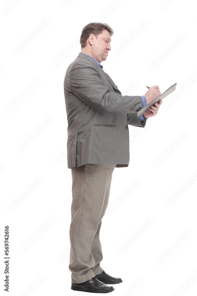 in full growth. serious business man with a clipboard. in full growth. serious business man with a clipboard.