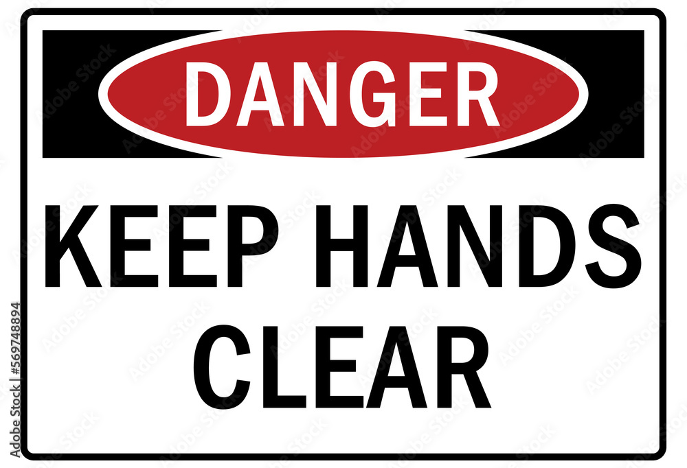 Machine hazard sign and labels keep hand clear Machine hazard sign and labels keep hand clear