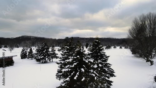 A golf course covered in dense snow in January. photo