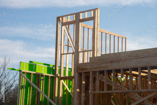 wooden frame structure house building on a new development framing of under construction house