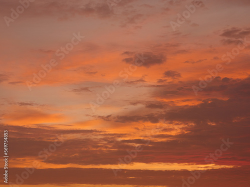 Sunset on the beach, golden hour, the sky is painted in orange and yellow colors © Prock86