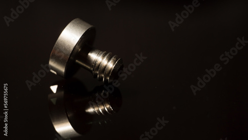 macro photo of a screw on a dark background