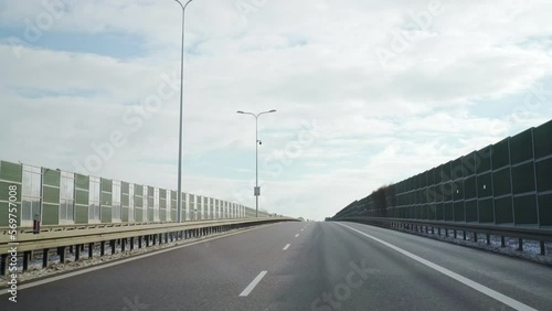 Wallpaper Mural He is driving uphill on a road with two lanes. The view through the windshield. Torontodigital.ca