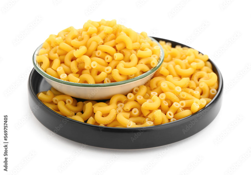 Plate of uncooked elbow pasta on white background Plate of uncooked elbow pasta on white background