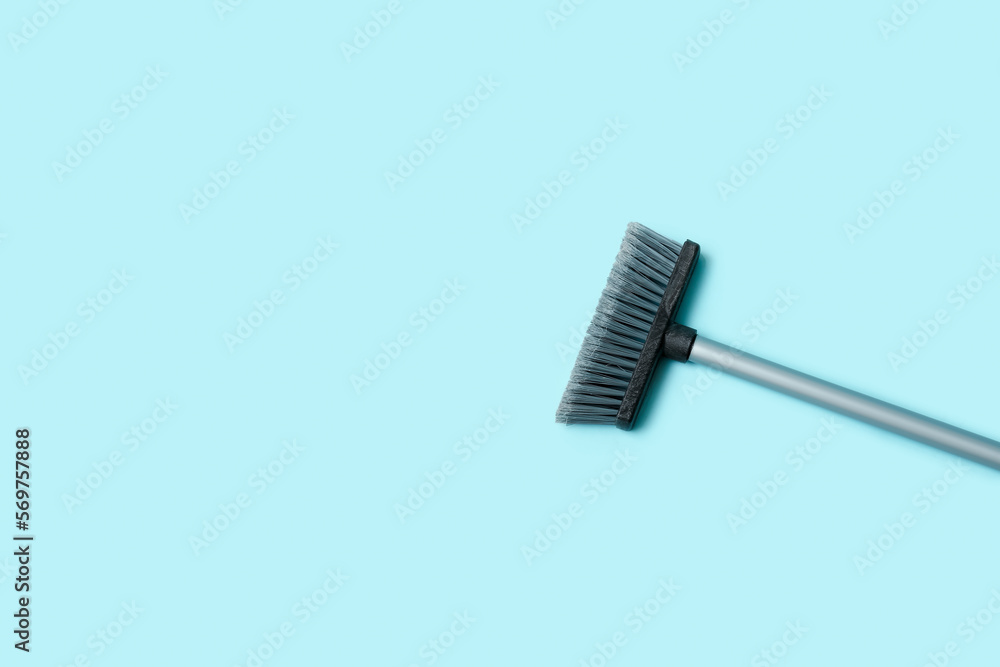 Plastic sweeping broom on color background Plastic sweeping broom on color background
