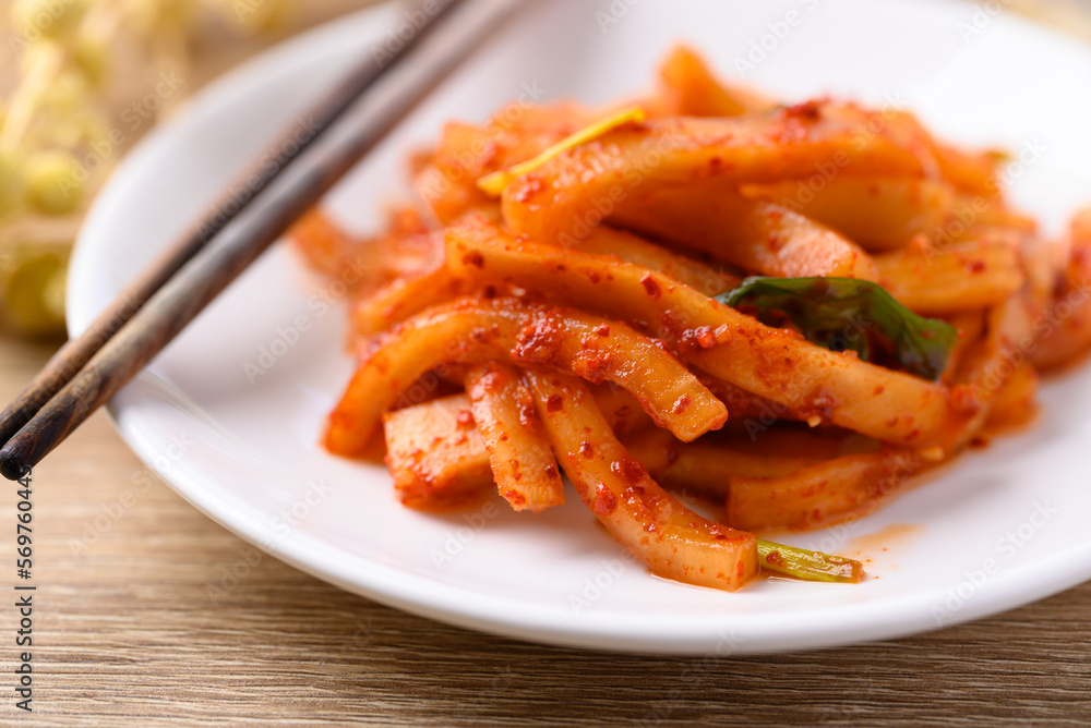 Kimchi radish on plate, Korean food homemade side dish Kimchi radish on plate, Korean food homemade side dish